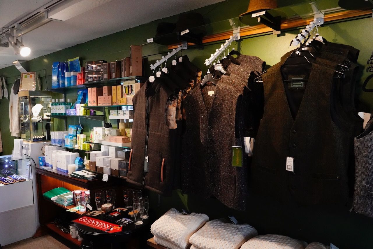 A store with a lot of clothes hanging on the wall