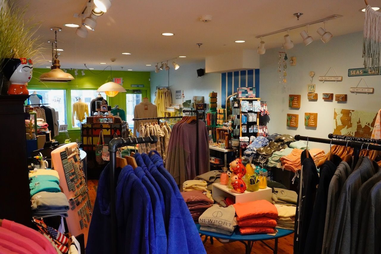 A clothing store with a lot of clothes on display