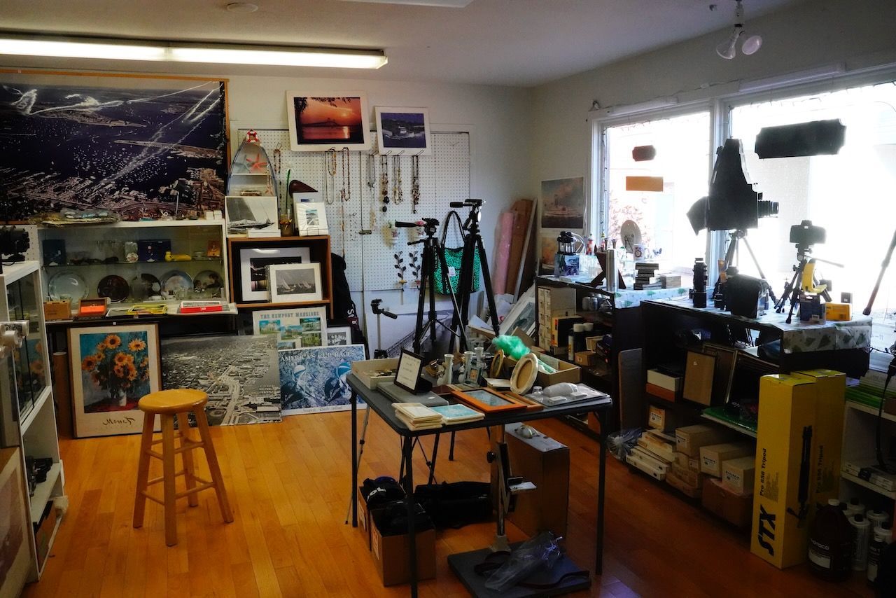 A room with a table and a stool in it