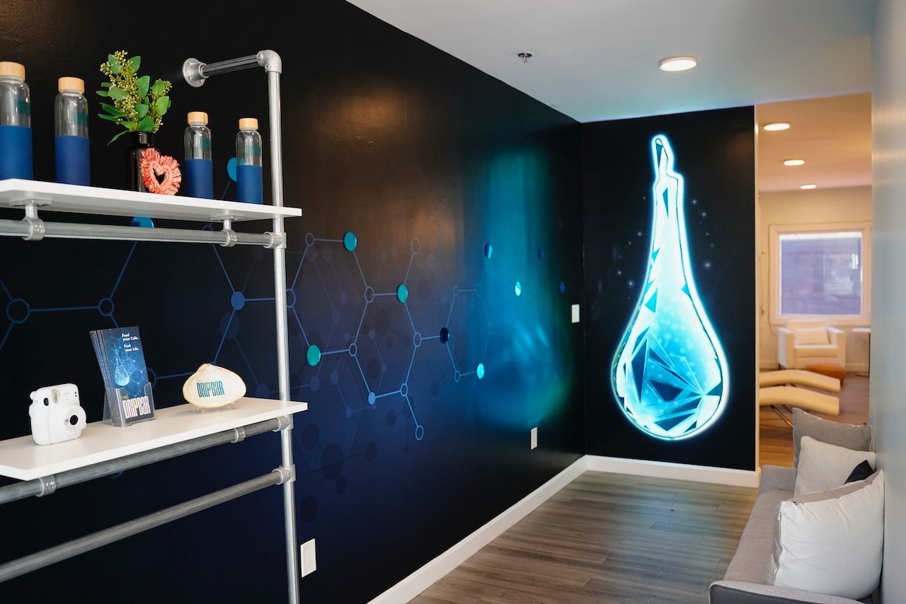 A room with a painting of a drop of water on the wall