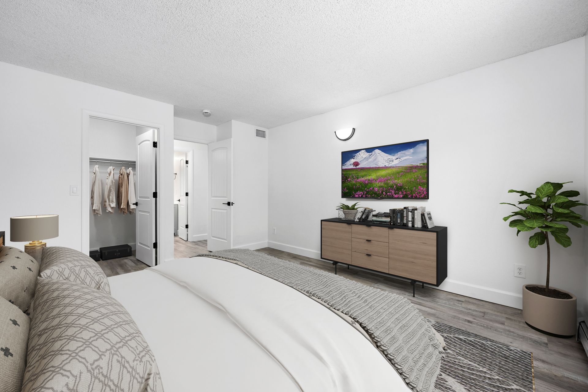 Photo of a bedroom showing a walk-in closet