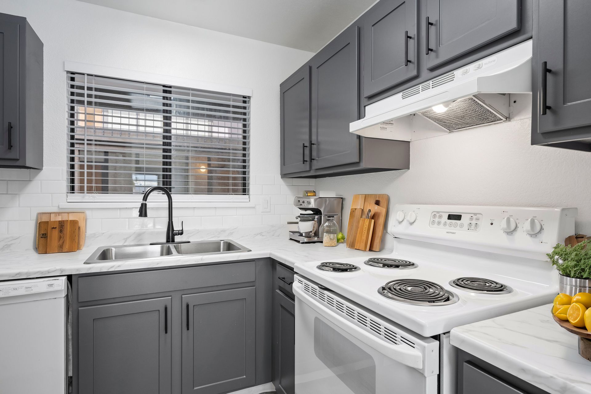 Photo of a kitchen with fresh paint and a medium-size sink