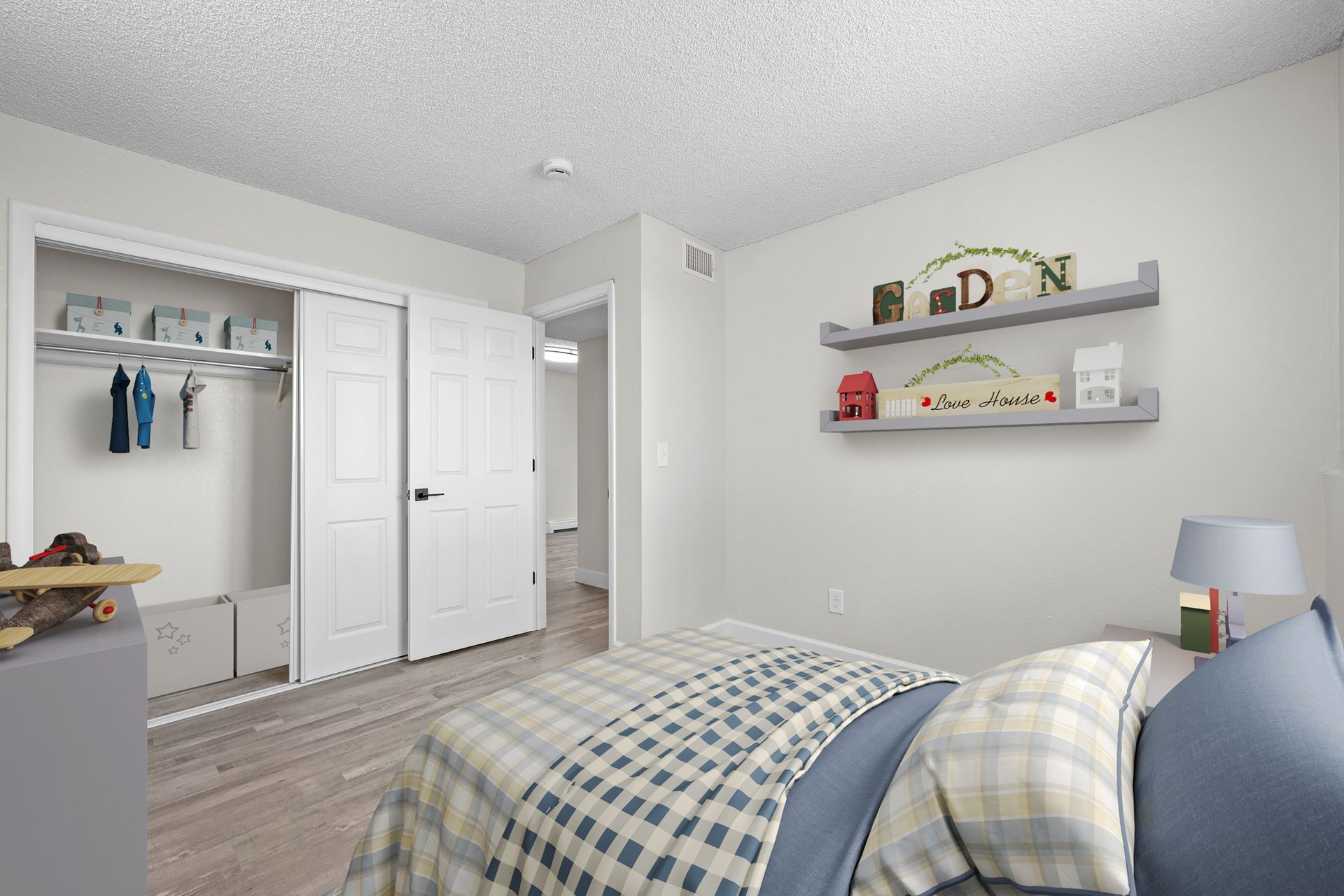 Photo of a kids bedroom, showing a wide closet