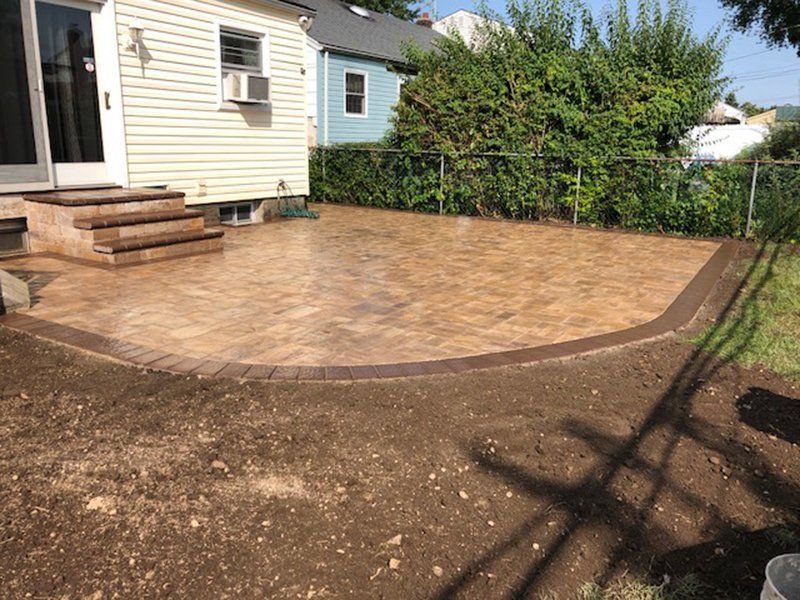 patio made of brown and dark brown bricks