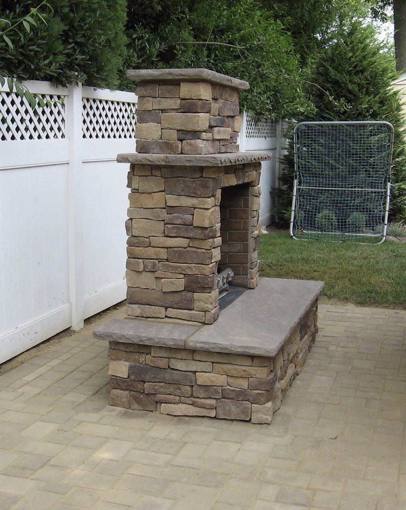 outside brown stone fire place side view