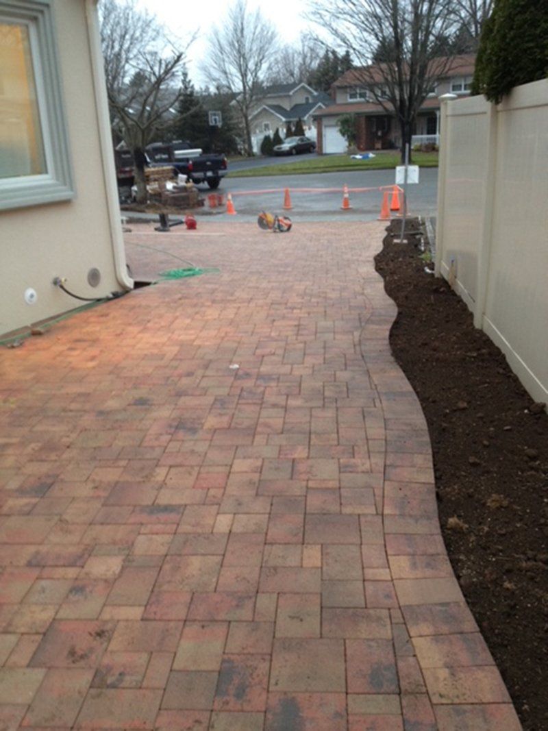 red brick driveway on side of house