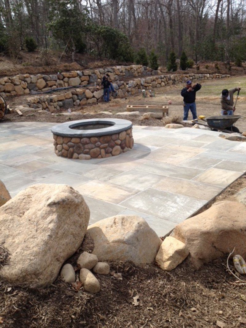 round fire place with round rocks around it's base