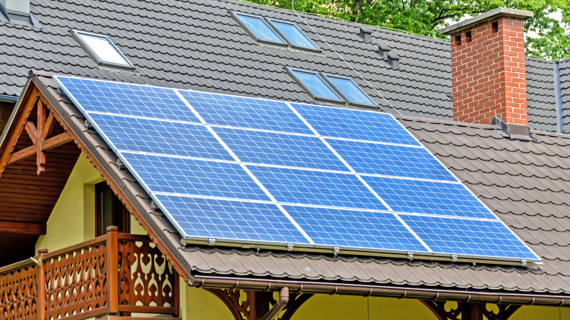 Solar panels on a house roof generate clean energy.