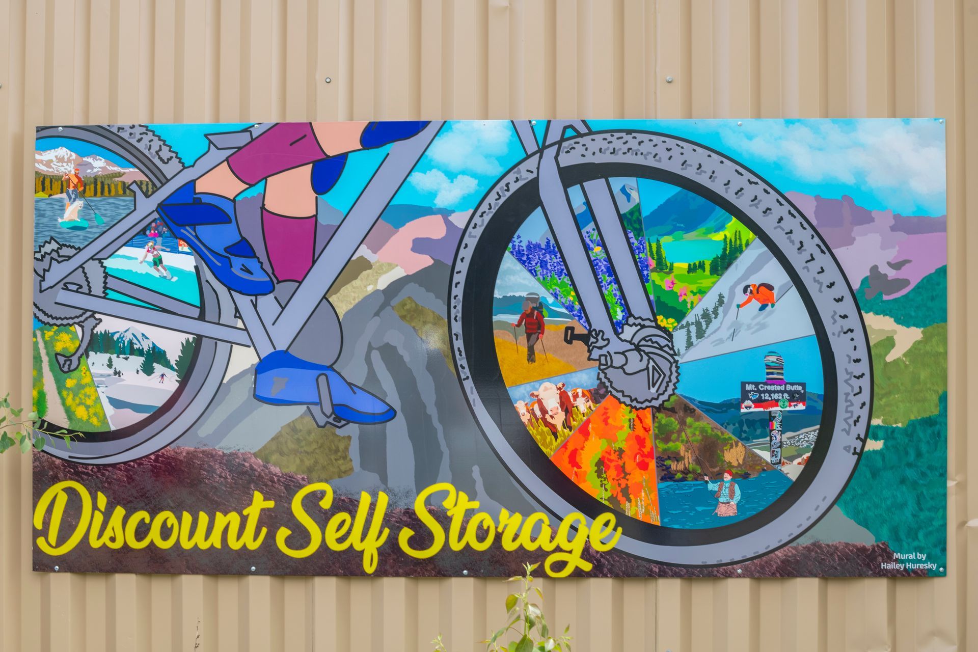 vibrant bike-themed mural at Discount Self Storage.