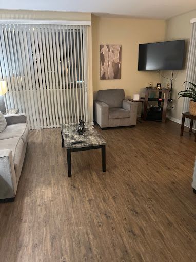 Spacious living room cleaned by Los Angeles house cleaners with dust-free surfaces and polished floors