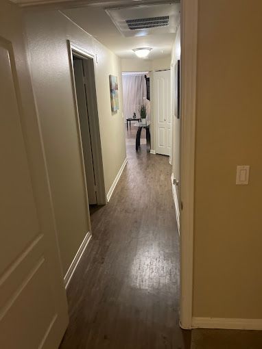 Freshly cleaned hallway with polished wood floors by residential cleaning company in Los Angeles
