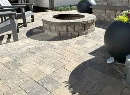 There is a fire pit in the middle of the patio.