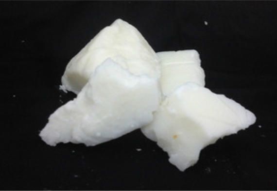 A pile of white pieces on a black surface