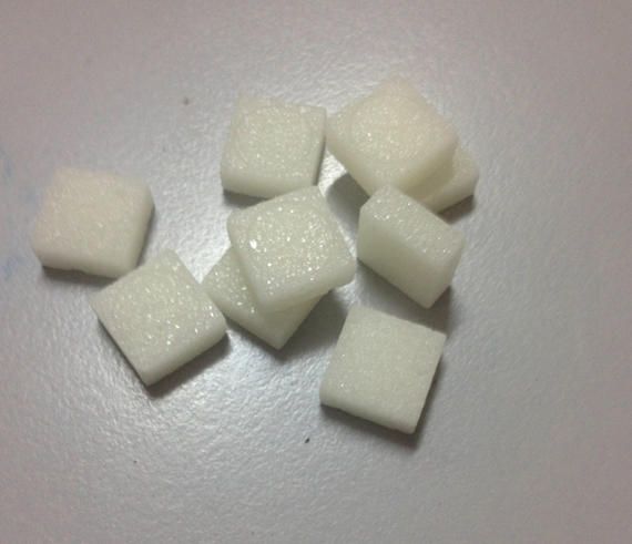 A pile of white squares on a white surface