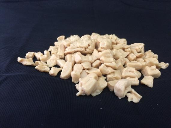 A pile of chicken pieces on a blue cloth