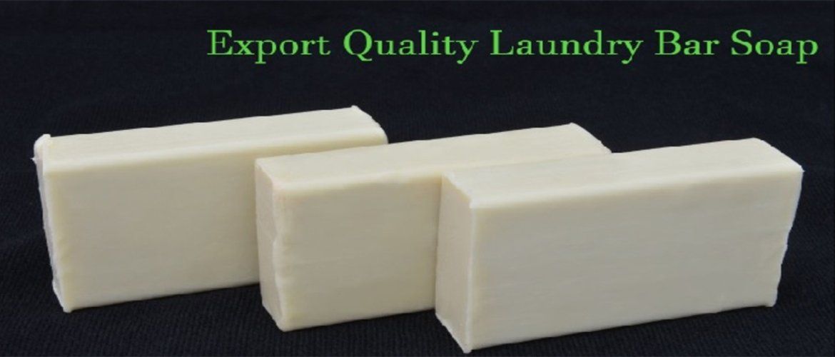 Three bars of export quality laundry bar soap on a black background