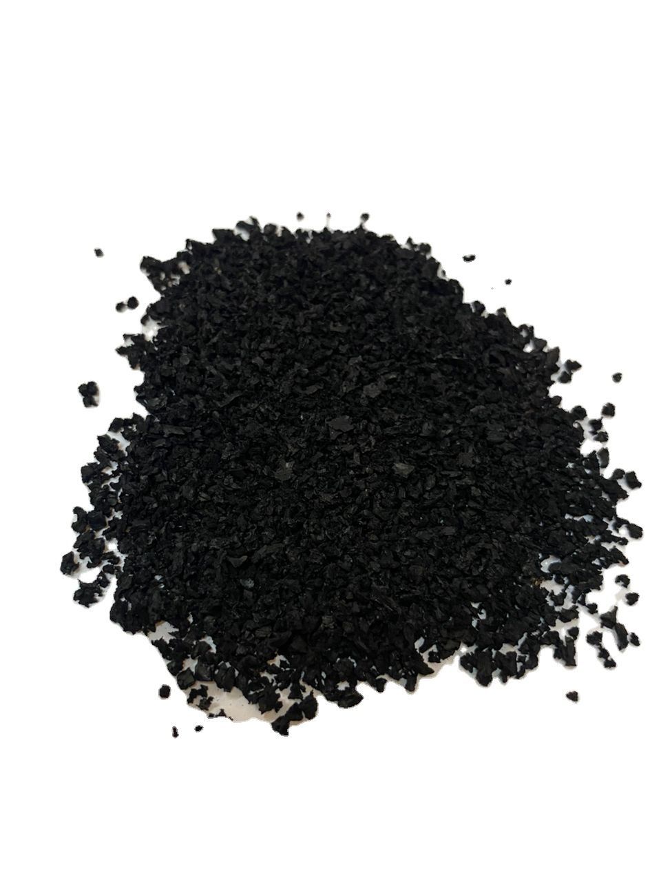 A pile of black powder on a white surface