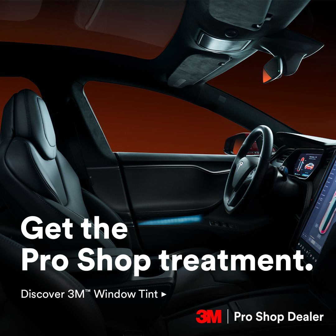 Car interior with dark tinted windows and 3M Pro Shop Dealer promotional text on a red-black background