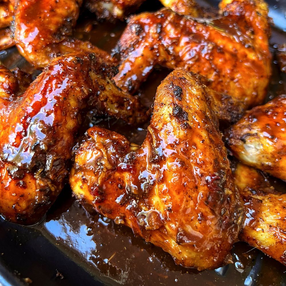 closeup chicken wings covered in Cowboy Korean BBQ Sauce