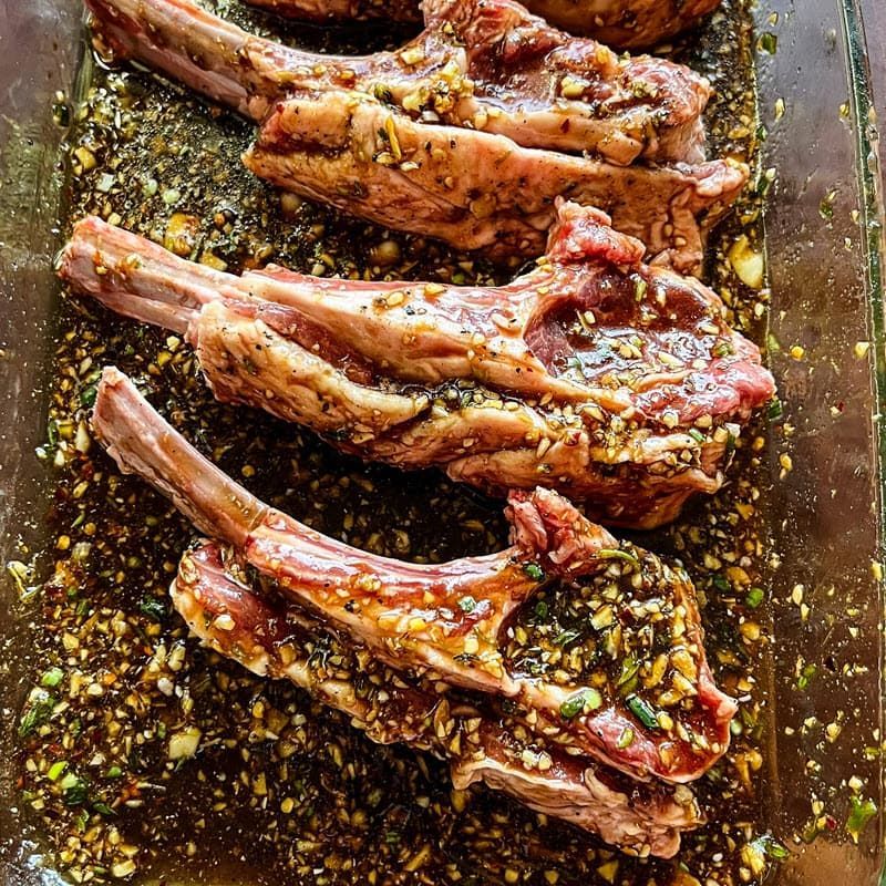 Marinated lamb chops on a cutting board