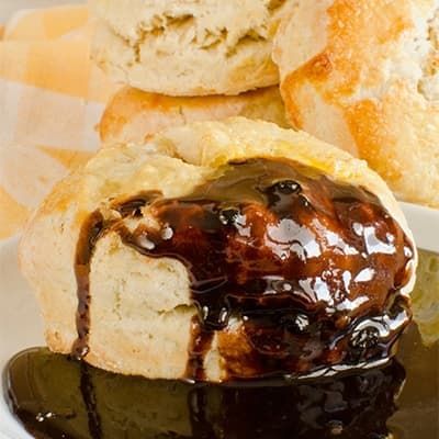 Arkansas Chocolate Gravy poured over a biscuit