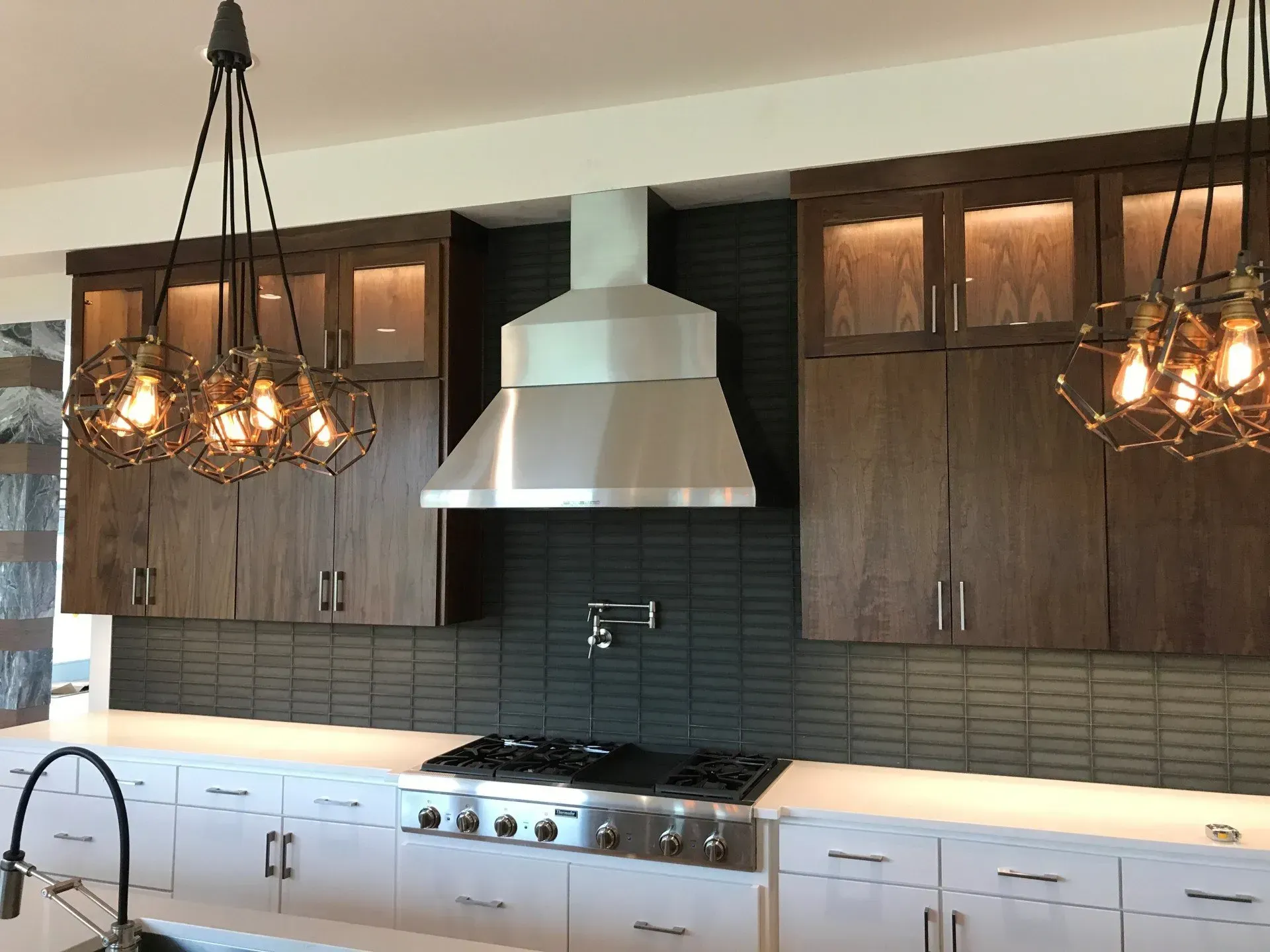 A kitchen with stainless steel appliances and wooden cabinets
