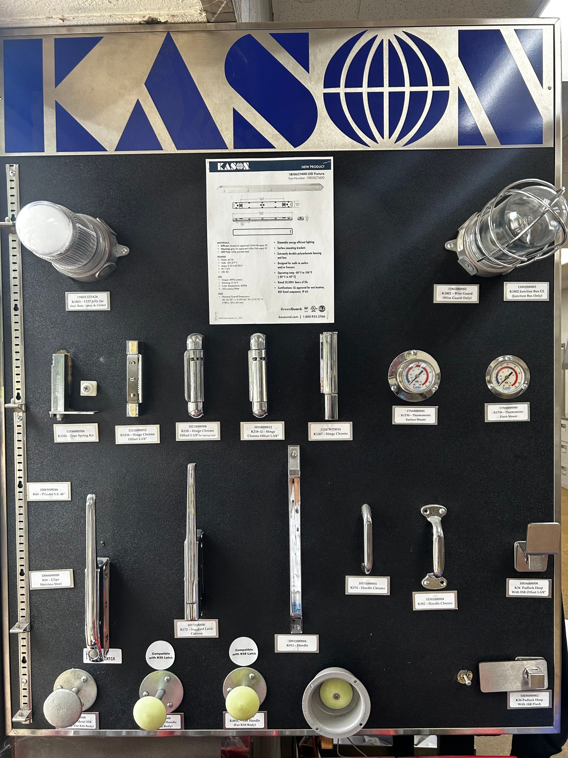 A display of various items under a sign that says kasox