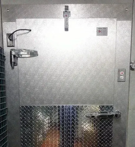 A metal door with a diamond plate on it
