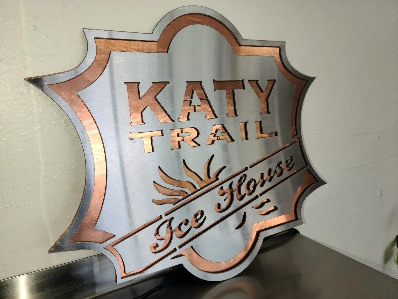 A sign that says katy trail ice house on it