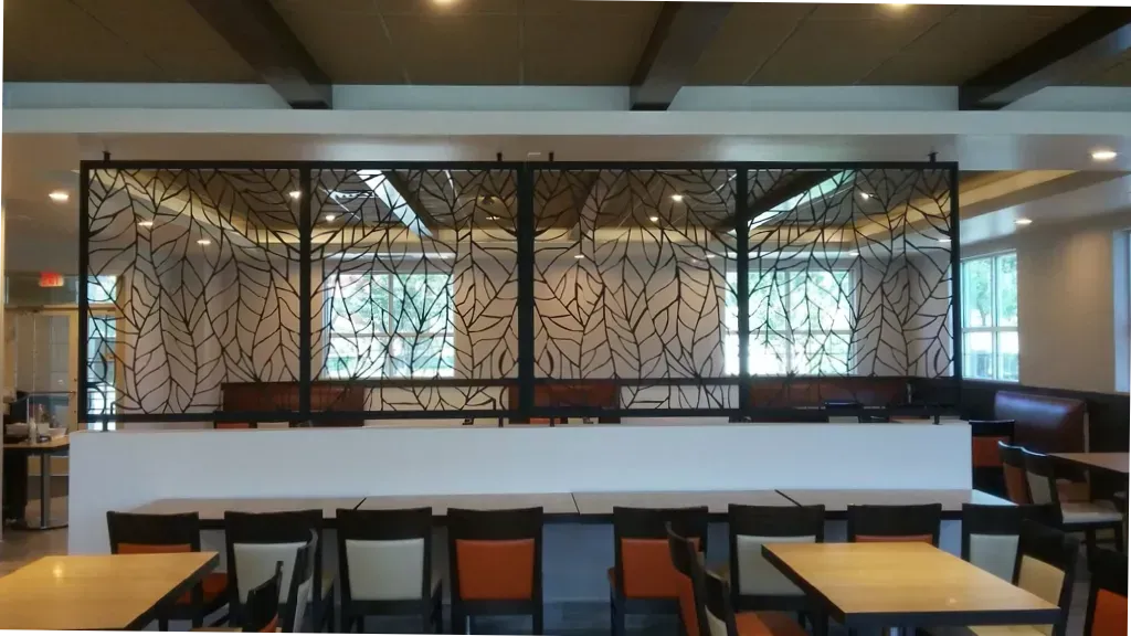 A restaurant with tables and chairs and a divider