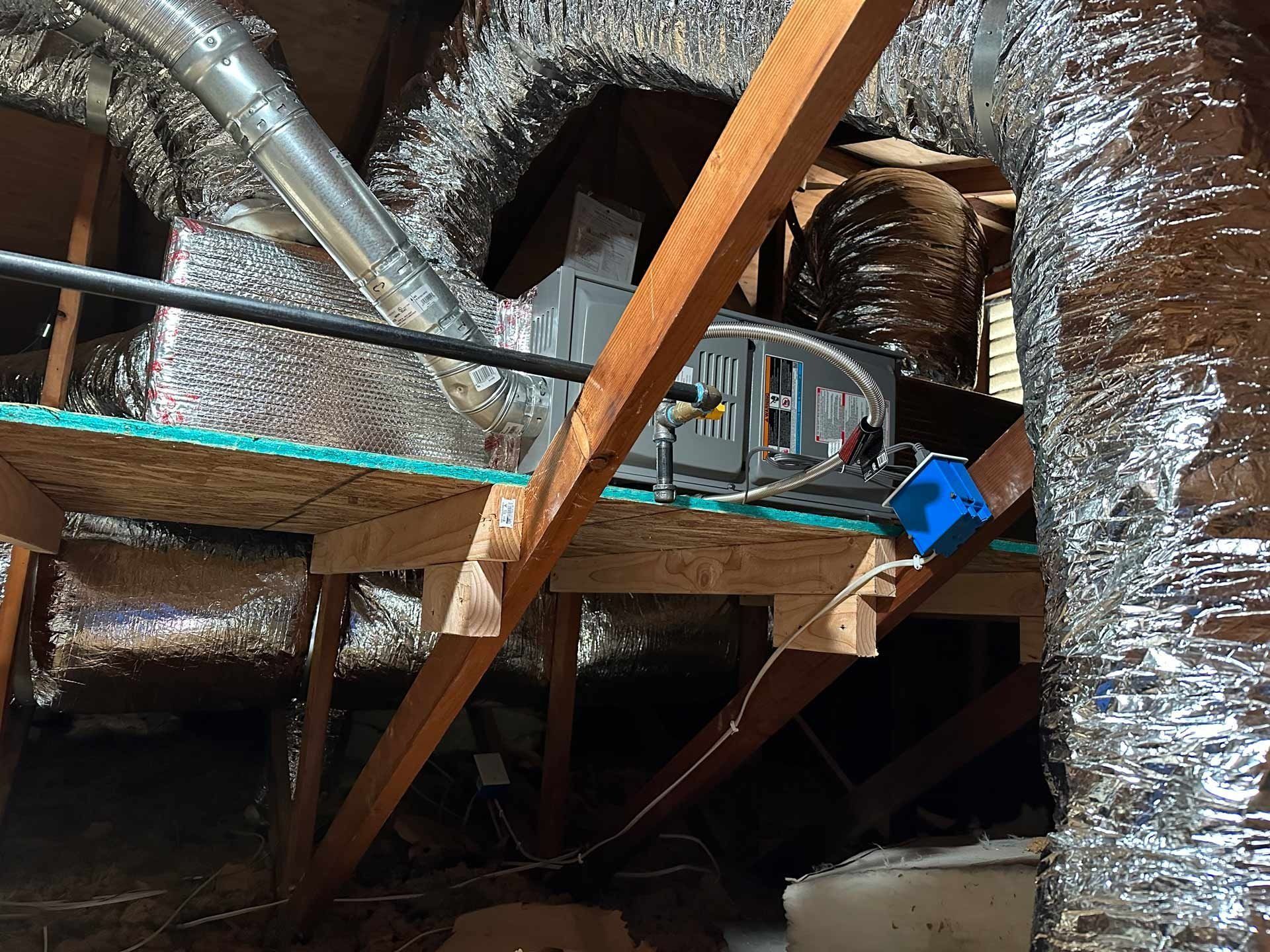 A ceiling with a lot of ducts and pipes