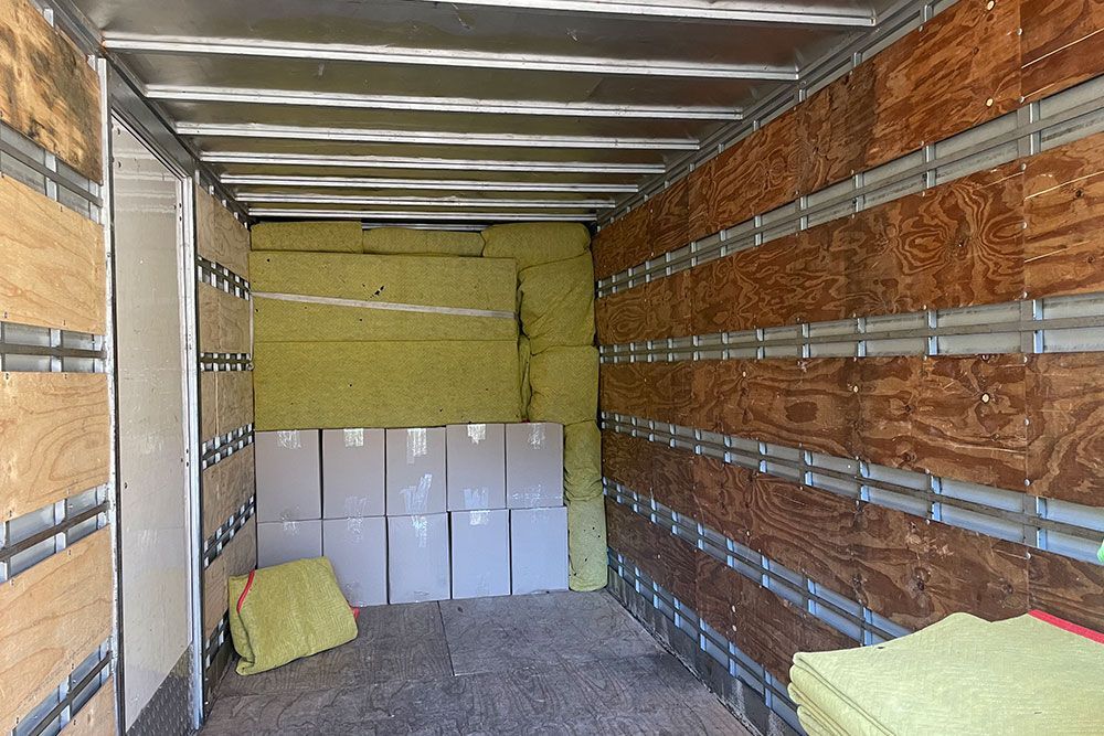 Inside Of The Transport Truck With Packed Items — Removals in Newcastle, NSW