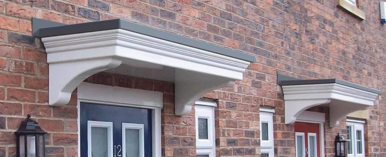 A brick building with a canopy over the front door.