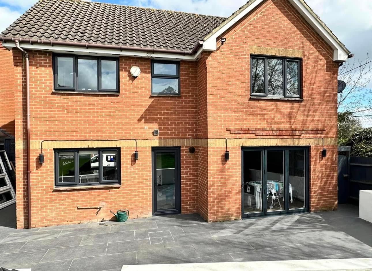 A large brick house with a lot of windows and doors.