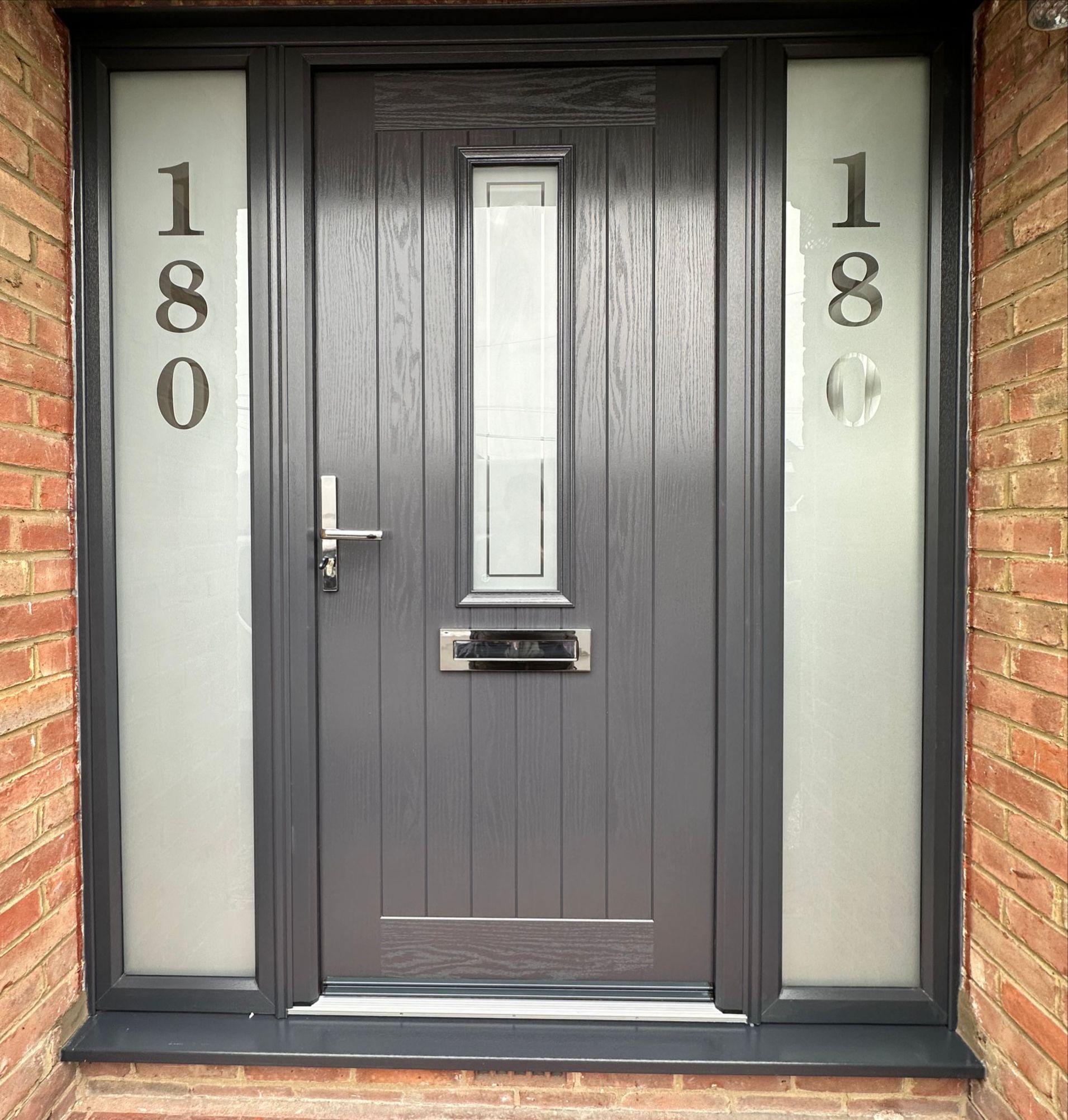 The front door of a house with the number 180 on it.