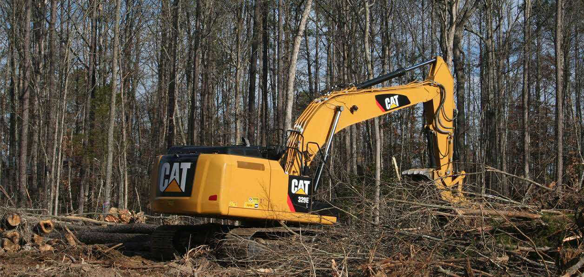 Cutting Tree Using Machine — Loganville, GA — Georgia's Best Clearing & Grading