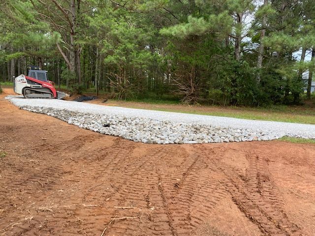 Excavating Machine on the Road — Loganville, GA — Georgia's Best Clearing & Grading