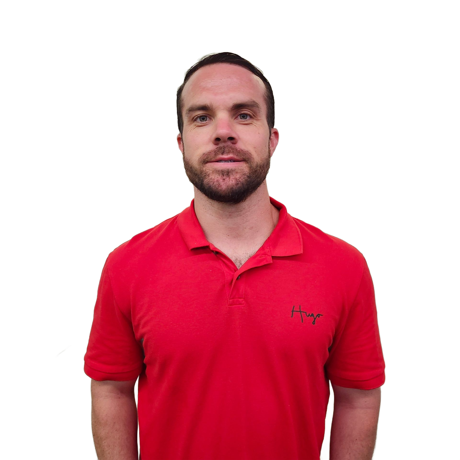 Man with beard wearing red polo shirt, standing against a white background.