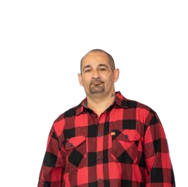 Man in red and black plaid shirt, smiling, facing forward. White background.