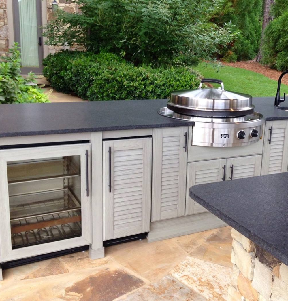 a fully built outdoor kitchen with updated amentities