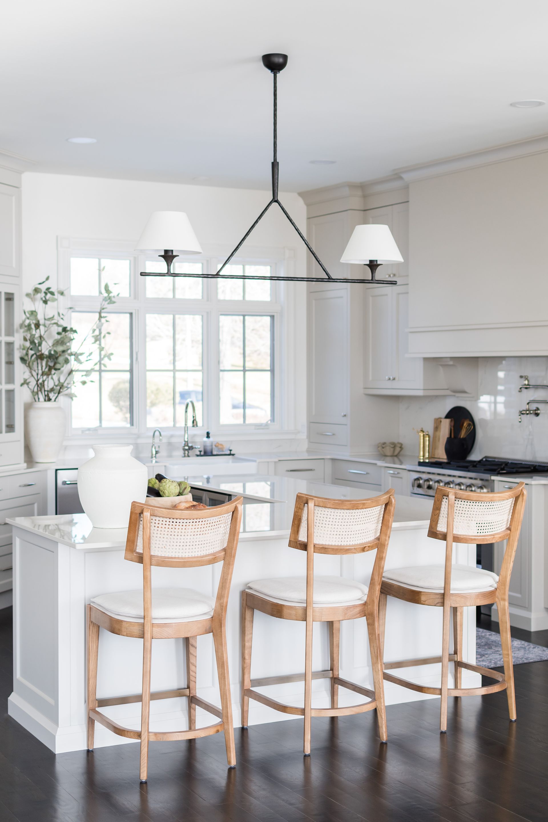 There is a large island in the middle of the kitchen.