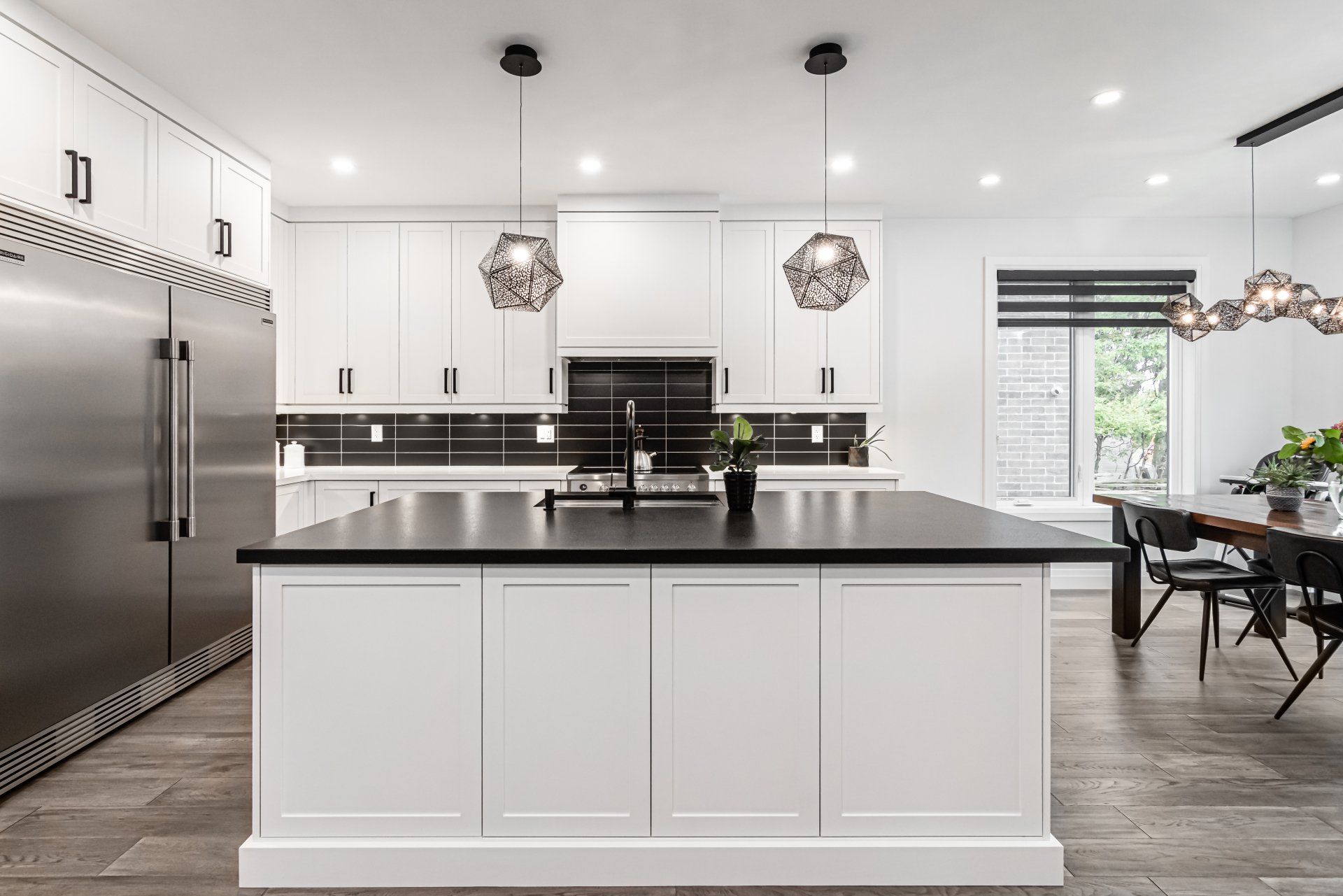 There is a large island in the middle of the kitchen.