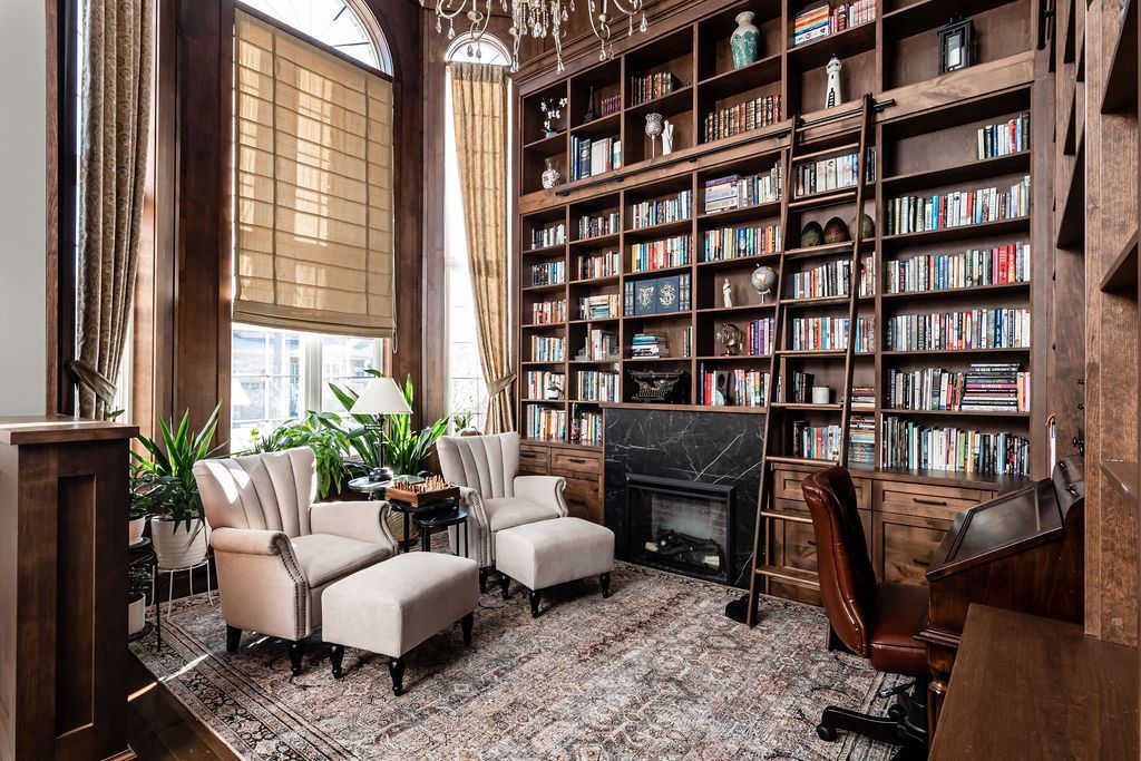 A kitchen with a large island and a stove top oven.