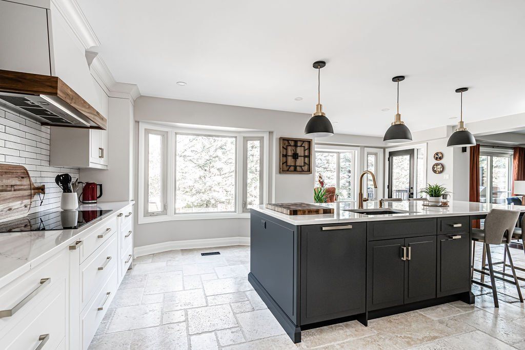There is a large island in the middle of the kitchen.