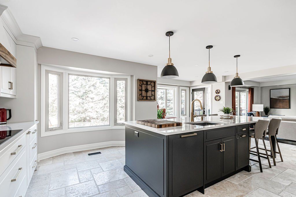 There is a large island in the middle of the kitchen.