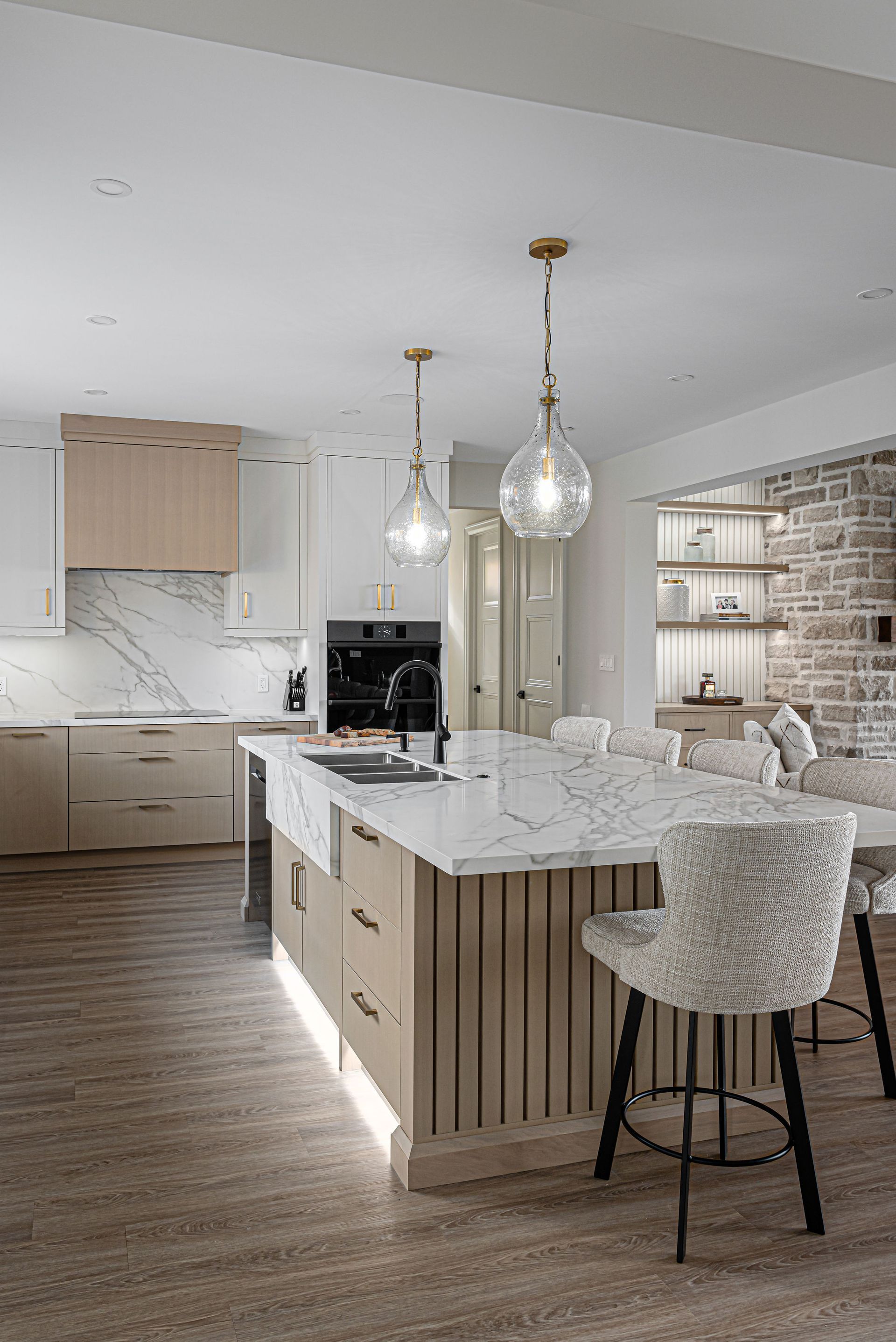 There is a large island in the middle of the kitchen.
