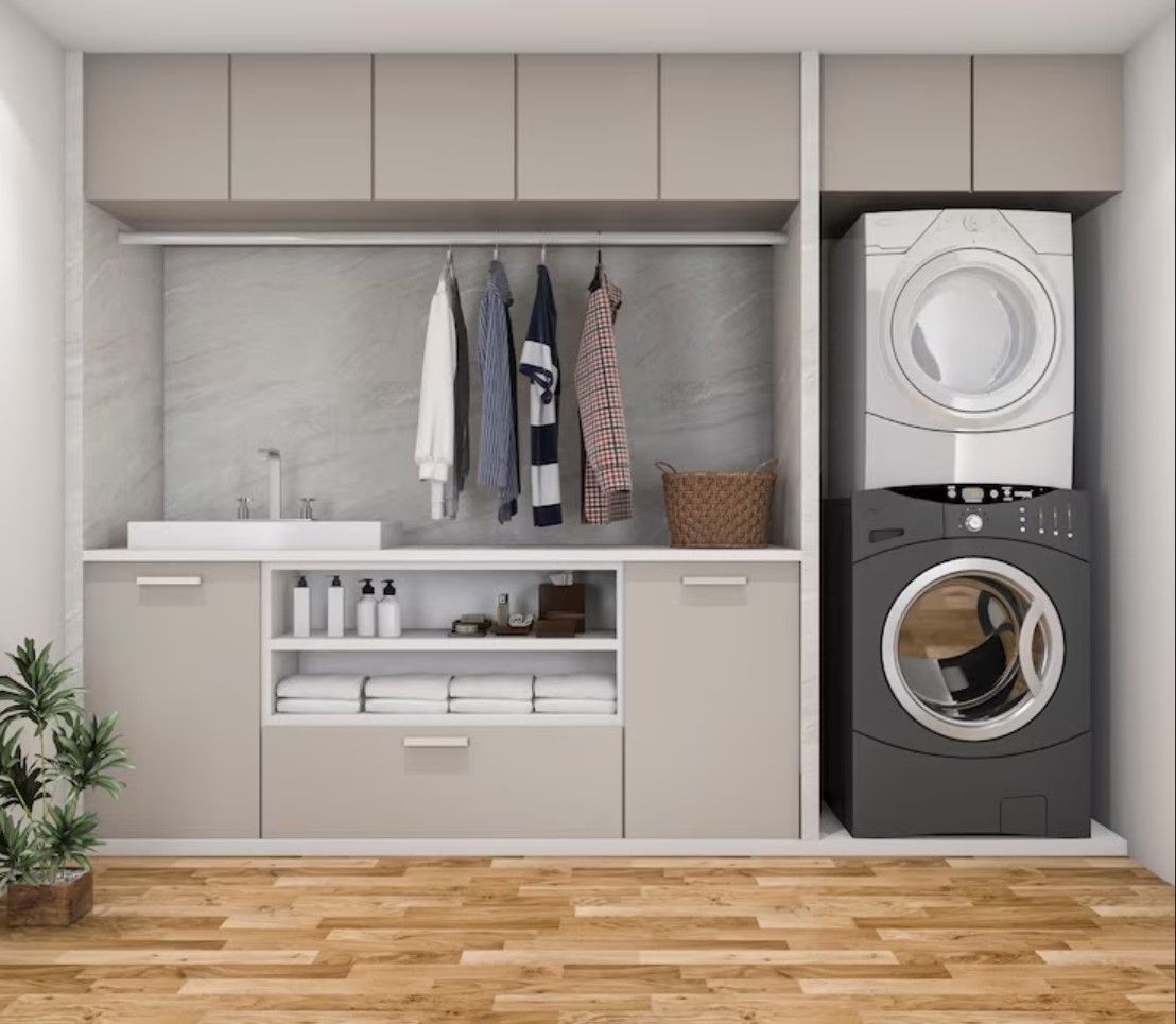 A laundry room with a washer and dryer stacked on top of each other.