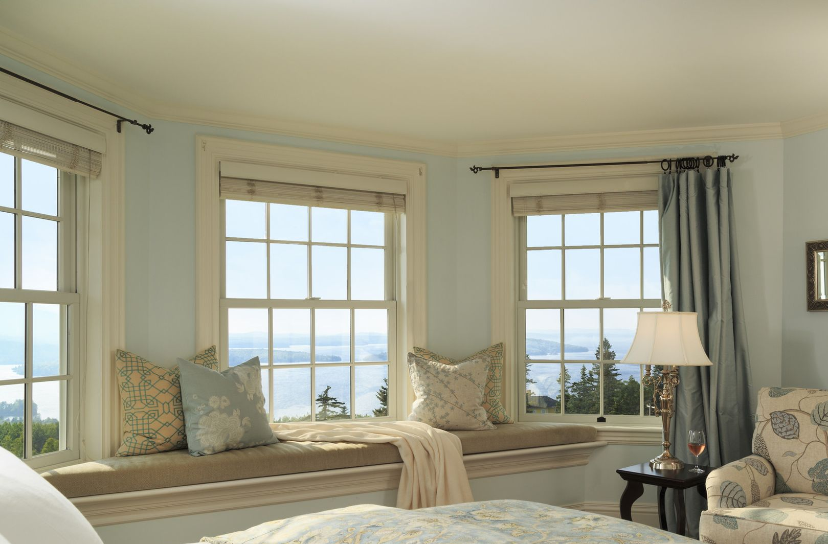 A natural coloured bathroom with two plant pots on the windowsill