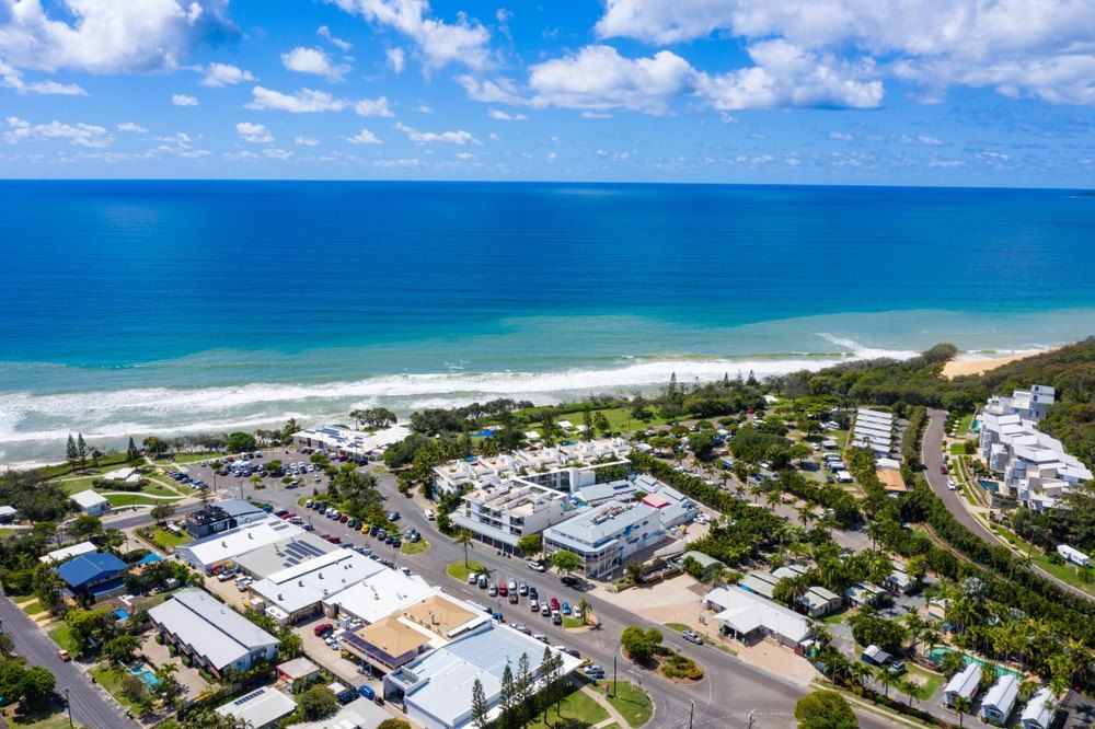An Aerial View of a Small Town Next to the Ocean — Trucking Crane Trucks in Gympie, QLD