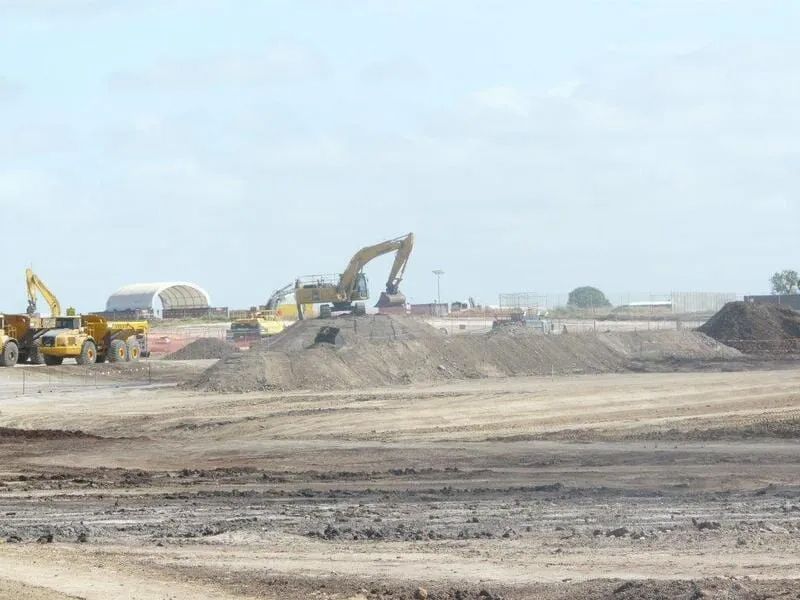 A Construction Site with A Lot of Trucks and Machinery — Mike Barlow Earthmoving Pty Ltd in Rockhampton, QLD